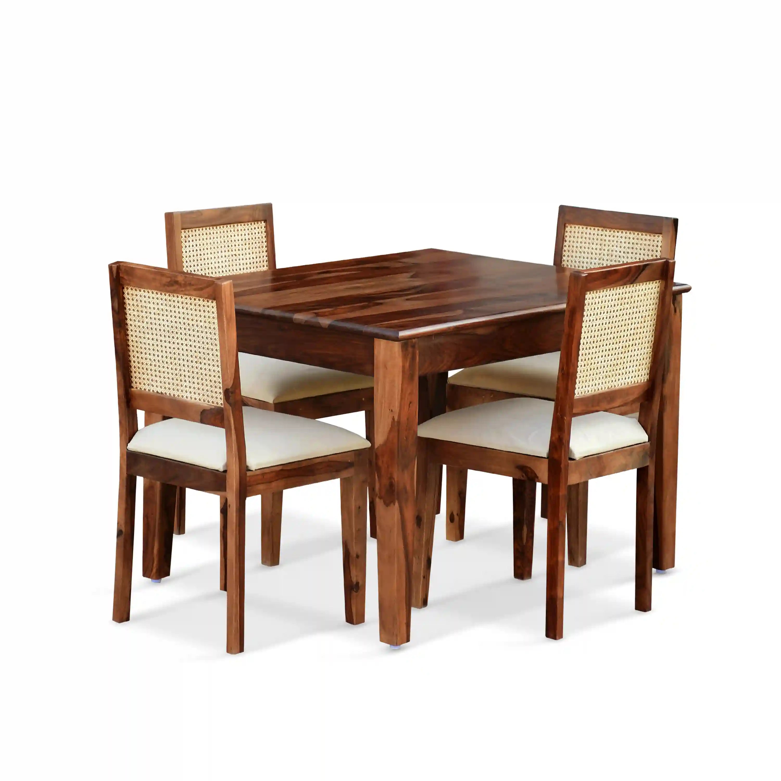 Solid wood cane four seater dining table set for home with durable design India