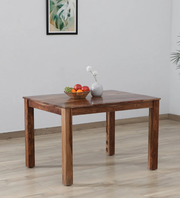 Saho Solid Wood 4 Seater Dining Table In Natural Teak Finish By Rajwada